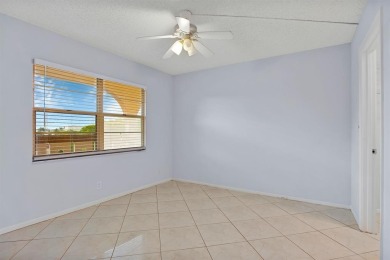 This top-floor condo is situated in Wynmoor's golf community and on Wynmoor Golf Course in Florida - for sale on GolfHomes.com, golf home, golf lot