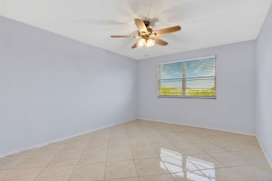 This top-floor condo is situated in Wynmoor's golf community and on Wynmoor Golf Course in Florida - for sale on GolfHomes.com, golf home, golf lot
