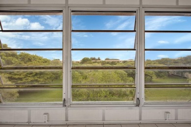 This top-floor condo is situated in Wynmoor's golf community and on Wynmoor Golf Course in Florida - for sale on GolfHomes.com, golf home, golf lot