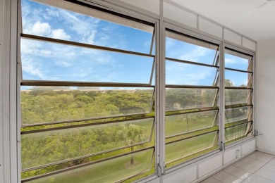 This top-floor condo is situated in Wynmoor's golf community and on Wynmoor Golf Course in Florida - for sale on GolfHomes.com, golf home, golf lot
