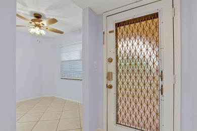 This top-floor condo is situated in Wynmoor's golf community and on Wynmoor Golf Course in Florida - for sale on GolfHomes.com, golf home, golf lot