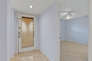 This top-floor condo is situated in Wynmoor's golf community and on Wynmoor Golf Course in Florida - for sale on GolfHomes.com, golf home, golf lot