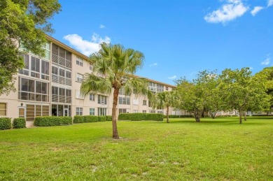 This top-floor condo is situated in Wynmoor's golf community and on Wynmoor Golf Course in Florida - for sale on GolfHomes.com, golf home, golf lot