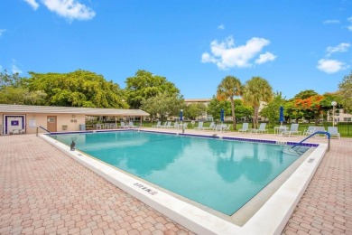 This top-floor condo is situated in Wynmoor's golf community and on Wynmoor Golf Course in Florida - for sale on GolfHomes.com, golf home, golf lot