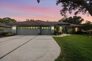 Welcome to this exceptional Costanza custom-built home on Tarpon Woods Golf Club in Florida - for sale on GolfHomes.com, golf home, golf lot