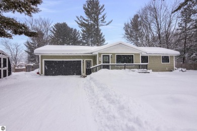 Nestled in a quiet and charming neighborhood just minutes from on Twin Birch Golf Club in Michigan - for sale on GolfHomes.com, golf home, golf lot