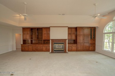 This expansive residence boasts 3 bedrooms, 3.5 bathrooms, and on Oyster Bay Golf Links in North Carolina - for sale on GolfHomes.com, golf home, golf lot