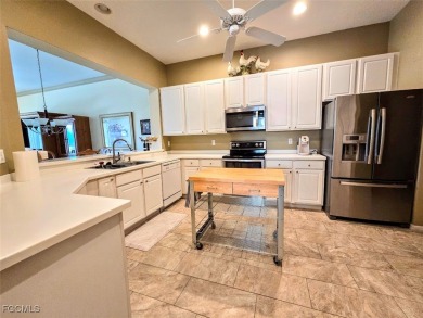 This beautifully maintained south-facing attached villa is on Fiddlesticks Country Club in Florida - for sale on GolfHomes.com, golf home, golf lot
