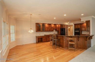 This expansive residence boasts 3 bedrooms, 3.5 bathrooms, and on Oyster Bay Golf Links in North Carolina - for sale on GolfHomes.com, golf home, golf lot