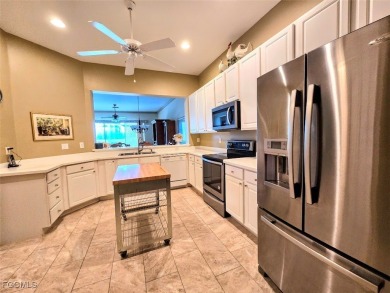 This beautifully maintained south-facing attached villa is on Fiddlesticks Country Club in Florida - for sale on GolfHomes.com, golf home, golf lot