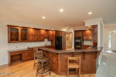 This expansive residence boasts 3 bedrooms, 3.5 bathrooms, and on Oyster Bay Golf Links in North Carolina - for sale on GolfHomes.com, golf home, golf lot