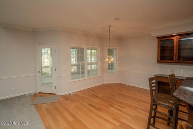 This expansive residence boasts 3 bedrooms, 3.5 bathrooms, and on Oyster Bay Golf Links in North Carolina - for sale on GolfHomes.com, golf home, golf lot