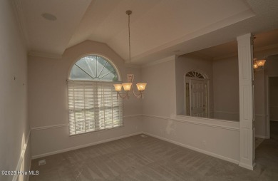 This expansive residence boasts 3 bedrooms, 3.5 bathrooms, and on Oyster Bay Golf Links in North Carolina - for sale on GolfHomes.com, golf home, golf lot