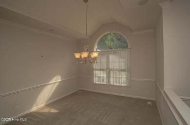 This expansive residence boasts 3 bedrooms, 3.5 bathrooms, and on Oyster Bay Golf Links in North Carolina - for sale on GolfHomes.com, golf home, golf lot