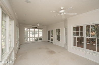 This expansive residence boasts 3 bedrooms, 3.5 bathrooms, and on Oyster Bay Golf Links in North Carolina - for sale on GolfHomes.com, golf home, golf lot