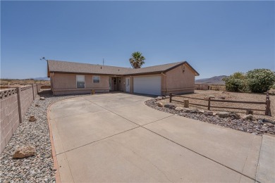 Nestled at 7820 E Devils Arch Dr, Kingman, Arizona, this on Valle Vista Golf Course in Arizona - for sale on GolfHomes.com, golf home, golf lot