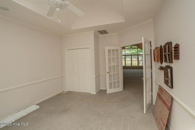 This expansive residence boasts 3 bedrooms, 3.5 bathrooms, and on Oyster Bay Golf Links in North Carolina - for sale on GolfHomes.com, golf home, golf lot