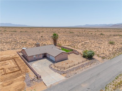 Nestled at 7820 E Devils Arch Dr, Kingman, Arizona, this on Valle Vista Golf Course in Arizona - for sale on GolfHomes.com, golf home, golf lot