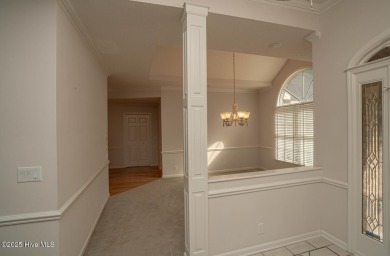 This expansive residence boasts 3 bedrooms, 3.5 bathrooms, and on Oyster Bay Golf Links in North Carolina - for sale on GolfHomes.com, golf home, golf lot