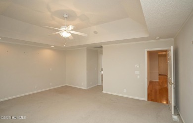 This expansive residence boasts 3 bedrooms, 3.5 bathrooms, and on Oyster Bay Golf Links in North Carolina - for sale on GolfHomes.com, golf home, golf lot
