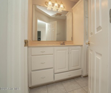 This expansive residence boasts 3 bedrooms, 3.5 bathrooms, and on Oyster Bay Golf Links in North Carolina - for sale on GolfHomes.com, golf home, golf lot