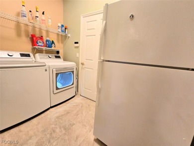 This beautifully maintained south-facing attached villa is on Fiddlesticks Country Club in Florida - for sale on GolfHomes.com, golf home, golf lot