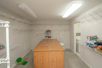 This expansive residence boasts 3 bedrooms, 3.5 bathrooms, and on Oyster Bay Golf Links in North Carolina - for sale on GolfHomes.com, golf home, golf lot
