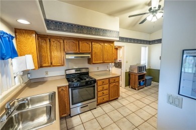 Nestled at 7820 E Devils Arch Dr, Kingman, Arizona, this on Valle Vista Golf Course in Arizona - for sale on GolfHomes.com, golf home, golf lot
