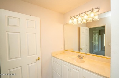 This expansive residence boasts 3 bedrooms, 3.5 bathrooms, and on Oyster Bay Golf Links in North Carolina - for sale on GolfHomes.com, golf home, golf lot