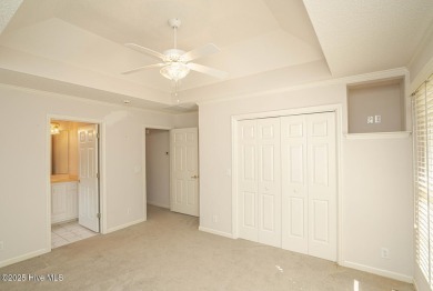 This expansive residence boasts 3 bedrooms, 3.5 bathrooms, and on Oyster Bay Golf Links in North Carolina - for sale on GolfHomes.com, golf home, golf lot