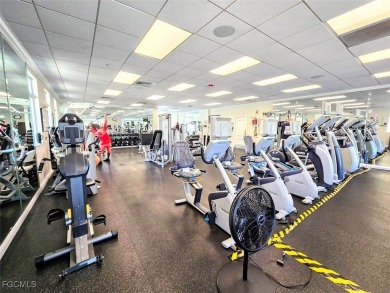 This beautifully maintained south-facing attached villa is on Fiddlesticks Country Club in Florida - for sale on GolfHomes.com, golf home, golf lot