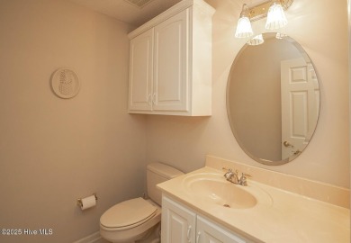 This expansive residence boasts 3 bedrooms, 3.5 bathrooms, and on Oyster Bay Golf Links in North Carolina - for sale on GolfHomes.com, golf home, golf lot