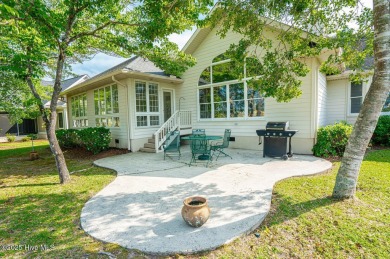 This expansive residence boasts 3 bedrooms, 3.5 bathrooms, and on Oyster Bay Golf Links in North Carolina - for sale on GolfHomes.com, golf home, golf lot