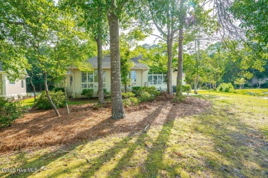 This expansive residence boasts 3 bedrooms, 3.5 bathrooms, and on Oyster Bay Golf Links in North Carolina - for sale on GolfHomes.com, golf home, golf lot