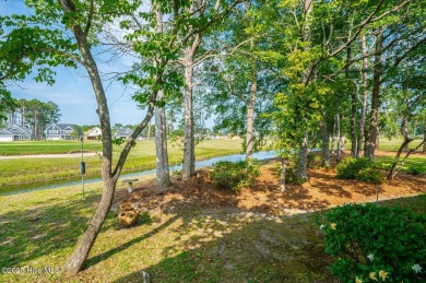 This expansive residence boasts 3 bedrooms, 3.5 bathrooms, and on Oyster Bay Golf Links in North Carolina - for sale on GolfHomes.com, golf home, golf lot