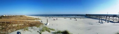 This expansive residence boasts 3 bedrooms, 3.5 bathrooms, and on Oyster Bay Golf Links in North Carolina - for sale on GolfHomes.com, golf home, golf lot