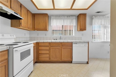 This charming home is in the highly sought-after gated community on Ashwood Golf Course in California - for sale on GolfHomes.com, golf home, golf lot