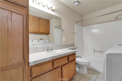 This charming home is in the highly sought-after gated community on Ashwood Golf Course in California - for sale on GolfHomes.com, golf home, golf lot