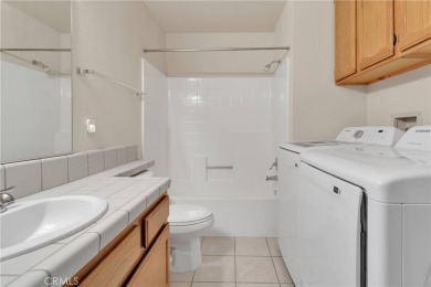 This charming home is in the highly sought-after gated community on Ashwood Golf Course in California - for sale on GolfHomes.com, golf home, golf lot