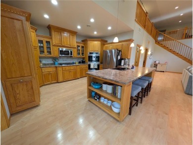 Stunning 4-bedroom, 3-bathroom home offering nearly 5,000 sq ft on Zumbrota Golf Club in Minnesota - for sale on GolfHomes.com, golf home, golf lot