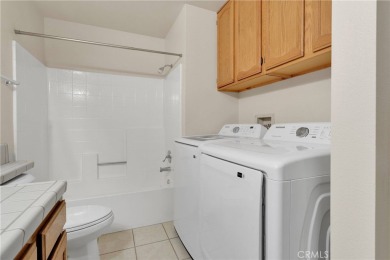 This charming home is in the highly sought-after gated community on Ashwood Golf Course in California - for sale on GolfHomes.com, golf home, golf lot