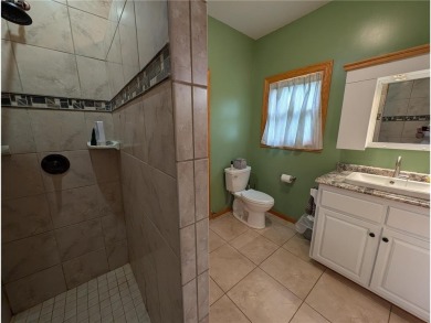 Stunning 4-bedroom, 3-bathroom home offering nearly 5,000 sq ft on Zumbrota Golf Club in Minnesota - for sale on GolfHomes.com, golf home, golf lot