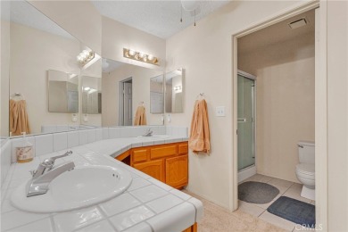 This charming home is in the highly sought-after gated community on Ashwood Golf Course in California - for sale on GolfHomes.com, golf home, golf lot