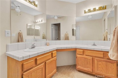This charming home is in the highly sought-after gated community on Ashwood Golf Course in California - for sale on GolfHomes.com, golf home, golf lot