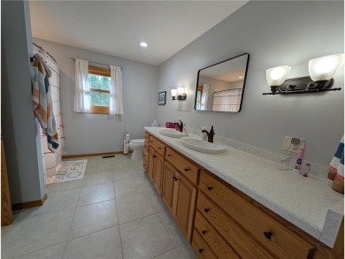Stunning 4-bedroom, 3-bathroom home offering nearly 5,000 sq ft on Zumbrota Golf Club in Minnesota - for sale on GolfHomes.com, golf home, golf lot