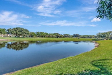 Custom built, luxury estate home with lake and golf course views on Mizner Country Club in Florida - for sale on GolfHomes.com, golf home, golf lot