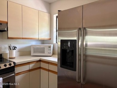 This two-bedroom townhome is located on the 12th hole of on Pinehurst  No. 6 Golf Course in North Carolina - for sale on GolfHomes.com, golf home, golf lot