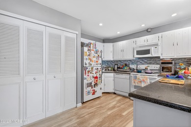 Quiet, private second-floor Navesink model set among the trees on Shadow Lake Village in New Jersey - for sale on GolfHomes.com, golf home, golf lot