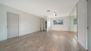 Rarely available and generously proportioned, this three-bedroom on Palm Aire Country Club of Sarasota in Florida - for sale on GolfHomes.com, golf home, golf lot