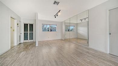 Rarely available and generously proportioned, this three-bedroom on Palm Aire Country Club of Sarasota in Florida - for sale on GolfHomes.com, golf home, golf lot